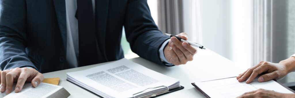 Lawyer Legal counsel presents to the client a signed contract